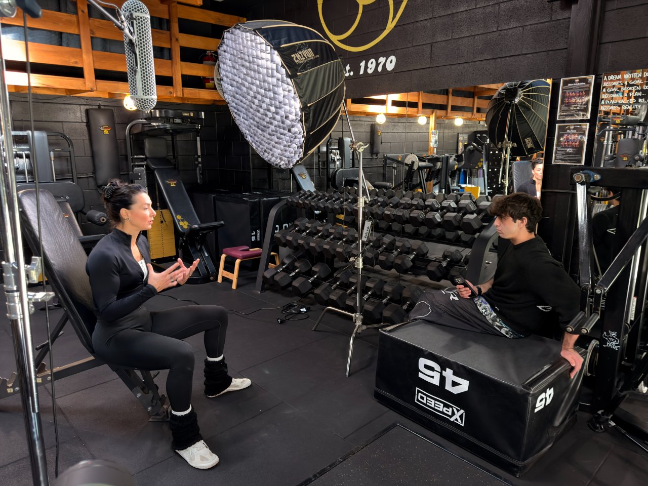 On set — interviewing a coach under a softbox key light, byljb shoot day